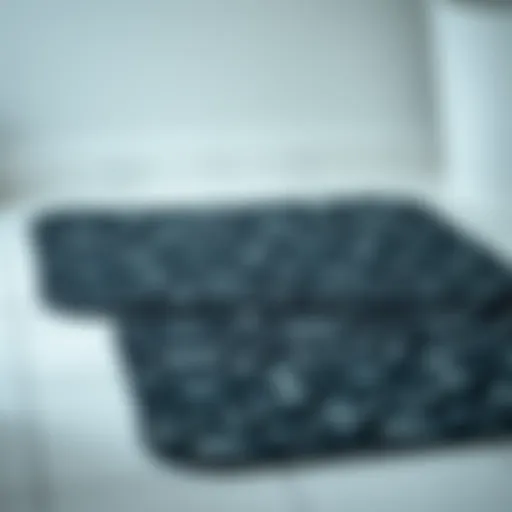 Elegant black patterned bath mat on a tiled floor