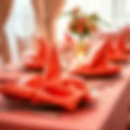Elegant coral napkins elegantly folded on a wedding table setting