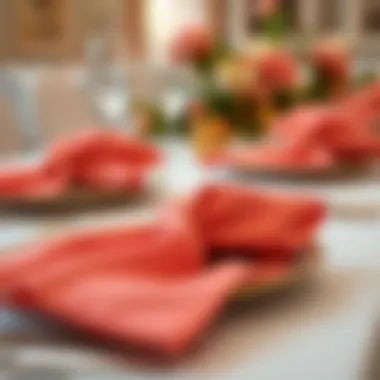 A close-up of coral napkins paired with gold tableware