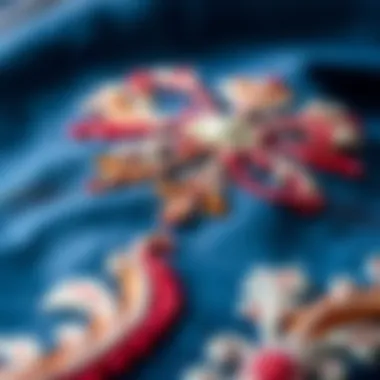 Intricate embroidery patterns on denim fabric