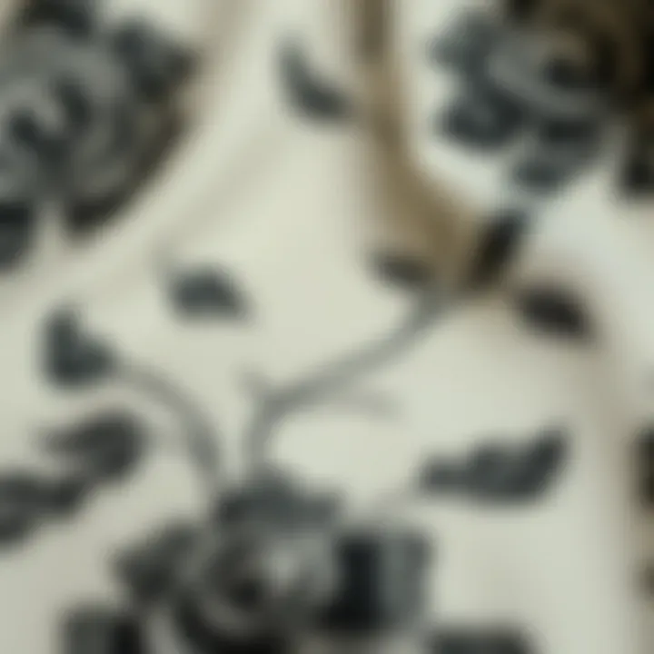 Close-up of intricate black rose design on luxurious fabric
