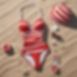 A vintage red and white bathing suit displayed on a sunny beach
