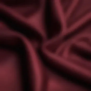 Close-up of rich burgundy fabric highlighting texture and elegance.