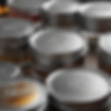 Close-up of stainless steel lids on glass spice jars