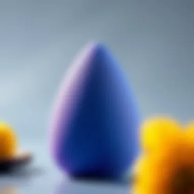 Close-up of a reusable makeup sponge in a vibrant color, showcasing its texture.