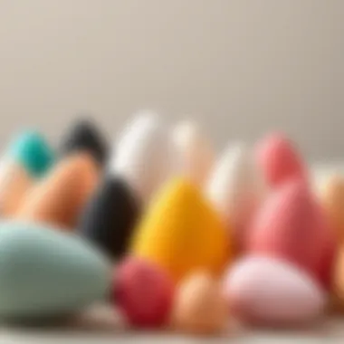 A collection of various shapes and sizes of reusable makeup sponges arranged aesthetically.