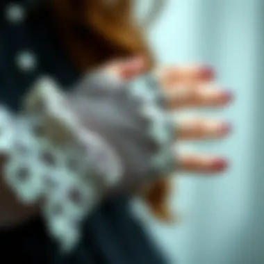 Close-up of intricate lace detailing on fingerless gloves.